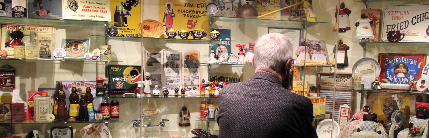 A visitor viewing the exhibits at the Jim Crow Museum 